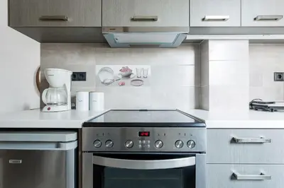a kitchen with a stove and a blender at Romantic Love-Nest Studio Near Acropolis & Metro in Athens