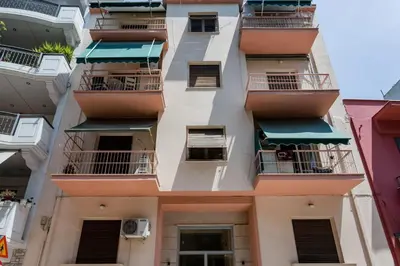 an apartment building with balconies in a city at Romantic Love-Nest Studio Near Acropolis & Metro in Athens