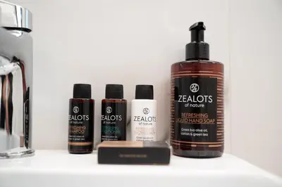 a group of four products sitting on a counter at Chroma Fashion Rooms & Apartments in Athens