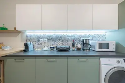 a kitchen with a counter with a microwave and a stove at Athenian Niche in Plaka Villa by Athenian Homes in Athens
