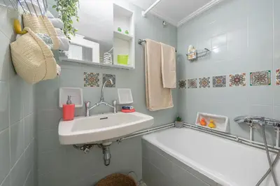 a bathroom with a sink and a bath tub at Sweet home in Koukaki in Athens