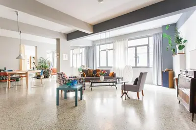a living room with a couch and a table at Miaouli8 in Athens