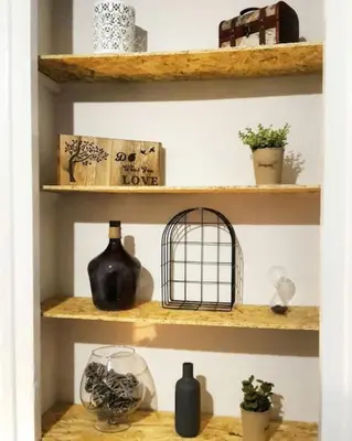 a shelf with vases and a bird cage on it at As Acropolis studio Apartment in Athens