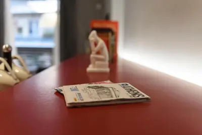 a table with a piece of paper on top of it at M&D Luxury Suites in central Athens in Athens