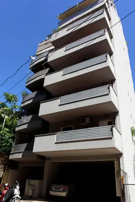 a tall building with balconies on the side of it at M&D Luxury Suites in central Athens in Athens