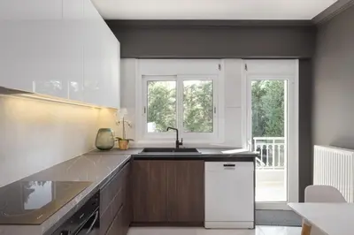 a kitchen with a sink and a window at Athenian Grand Riviera Villa in Athens