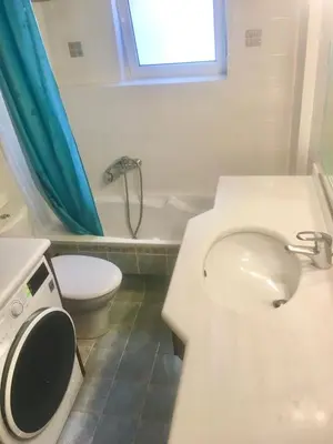 a bathroom with a toilet and a sink and a tub at My Way Hotel in Athens