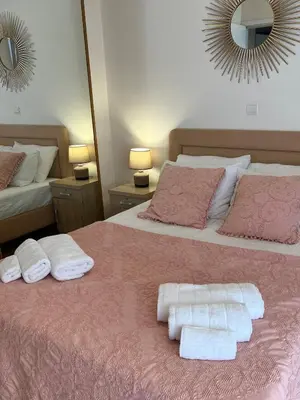 a bedroom with two beds with towels on them at My Way Hotel in Athens