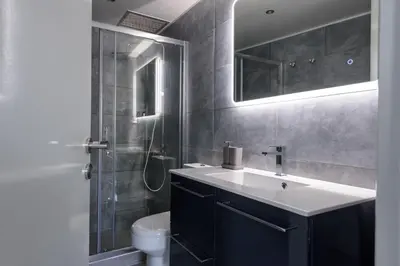 a bathroom with a sink and a toilet at Fos Residential Apartments in Athens