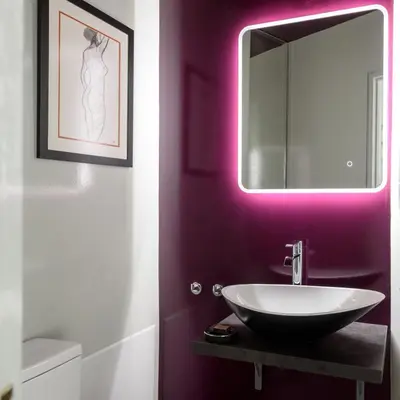 a bathroom with a sink and a mirror at Fos Residential Apartments in Athens