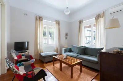 a living room with a couch and a table at M&N Koukaki House in Athens