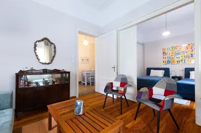 a bedroom with a bed and a table and chairs at M&N Koukaki House in Athens