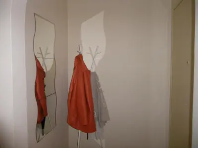 three pieces of clothing hanging on a wall at By Lycabettus in the city-heart close to Acropolis in Athens