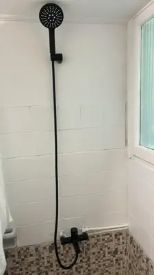 a shower in the corner of a bathroom at By Lycabettus in the city-heart close to Acropolis in Athens