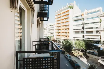 an apartment balcony with a view of a city at Athens Studios in Athens
