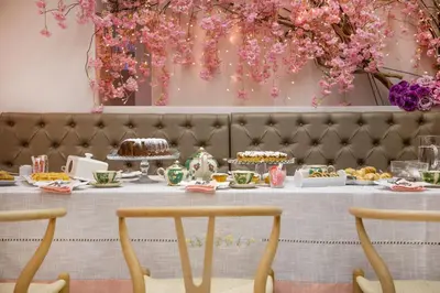 a table with food and flowers on it at Sweet Home Hotel in Athens