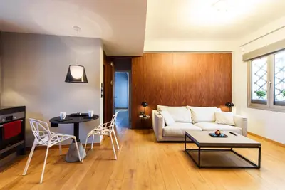 a living room with a couch and a table at Acropolis Dream Apartment in Athens