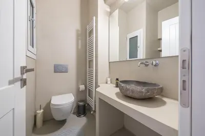a bathroom with a sink and a toilet at Pame Rentals - 2BD & 2BA Home, 4 Min to Acropolis in Athens