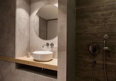 a bathroom with a sink and a mirror at Designer Apartment - stroll to the Acropolis in Athens