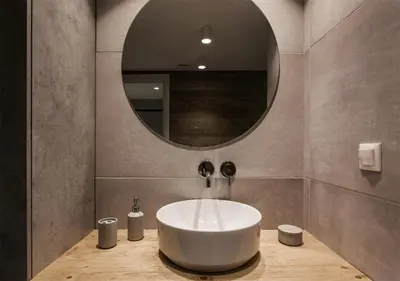 a bathroom with a white sink and a mirror at Designer Apartment - stroll to the Acropolis in Athens