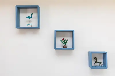 four pictures of birds and a vase on a wall at Central Stay Athens in Athens