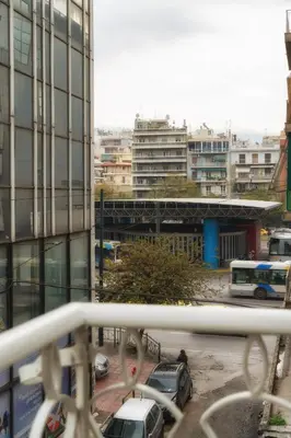 a view of a city with cars parked in a parking lot at Absolute Athens VI in Athens