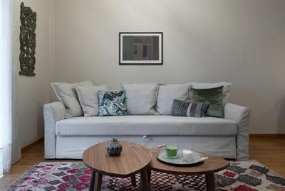a living room with a couch and a table at Absolute Athens VI in Athens
