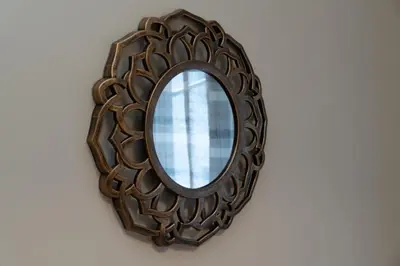a mirror with a wooden frame on a wall at Absolute Athens VII in Athens
