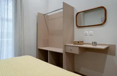 a white room with a mirror and a bed at Absolute Athens VII in Athens