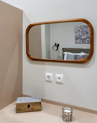a bathroom with a mirror over a white sink at Absolute Athens VII in Athens