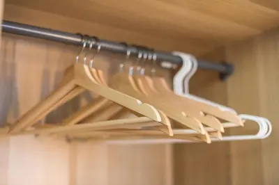 a bunch of wooden utensils are hanging on a rack at Plaka Akrokeramo House #1 in Athens