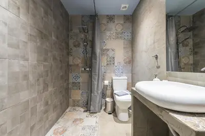 a bathroom with a sink and a toilet at Plaka Akrokeramo House #1 in Athens