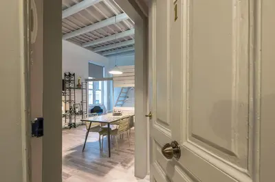 a hallway with a table and a dining room at Plaka Akrokeramo House #1 in Athens