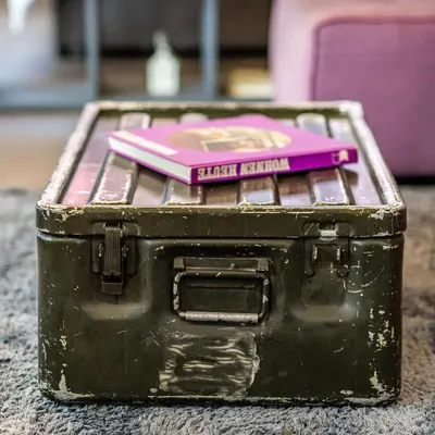an old black suitcase with a pink book on top at Boutique Apartment in Athens Center in Athens