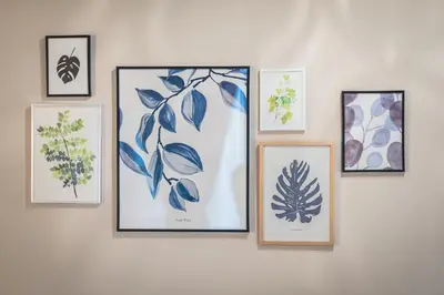 a group of framed pictures on a wall at Plaka Akrokeramo House #2 in Athens