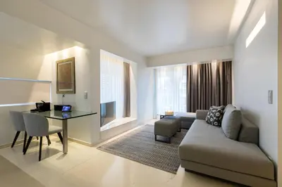 a living room with a couch and a table at Brasil Suites Boutique Hotel in Athens