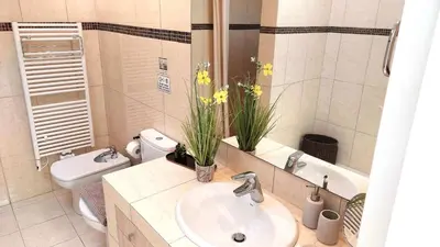 a bathroom with a sink and a toilet at Holiday villa SUNJOY close to the beach in Sounio