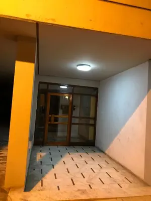 an empty room with a glass door in a building at Luxury apartment close to city center, university and children's hospital in Athens