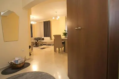 a room with a living room and a dining room at Athenian Riviera Apartment in Athens