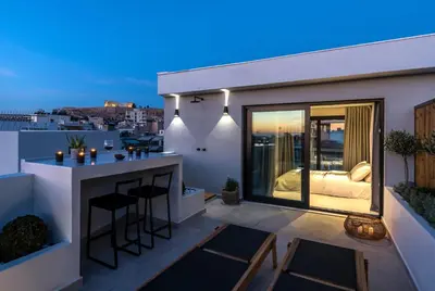 a balcony of a house with a bar at Hub Suites, Luxury living in Athens in Athens