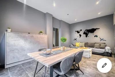 a living room with a table and a couch at L apartment in Athens