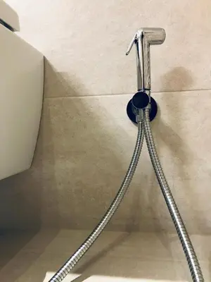 a shower hose hooked up to a wall at Luxury & Stylish Family Apartment in Athens