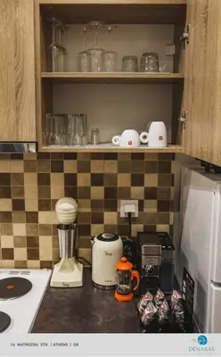 a kitchen counter with a blender on a counter top at Denaxas Apartments in the heart of Athens in Athens