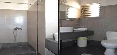a bathroom with a toilet and a sink and a shower at Sparta Team Hotel in Athens