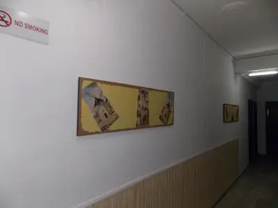 a painting hanging on a wall in a hallway at Sparta Team Hotel in Athens
