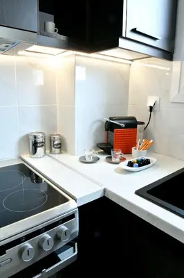 a kitchen with a stove and a counter top at Krezias Apartments E7 in Athens