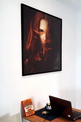 a painting of a woman hanging on a wall at Krezias Apartments E7 in Athens