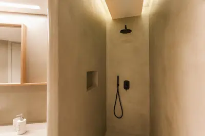 a shower in a bathroom with a phone on the wall at *** Apt 110m2 3bed 2bath, walk to Acropolis *** in Athens
