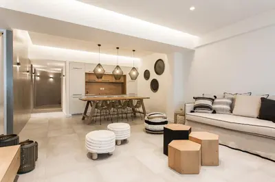a living room with a couch and a table at *** Apt 110m2 3bed 2bath, walk to Acropolis *** in Athens