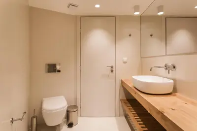a bathroom with a white sink and a toilet at *** Apt 110m2 3bed 2bath, walk to Acropolis *** in Athens
